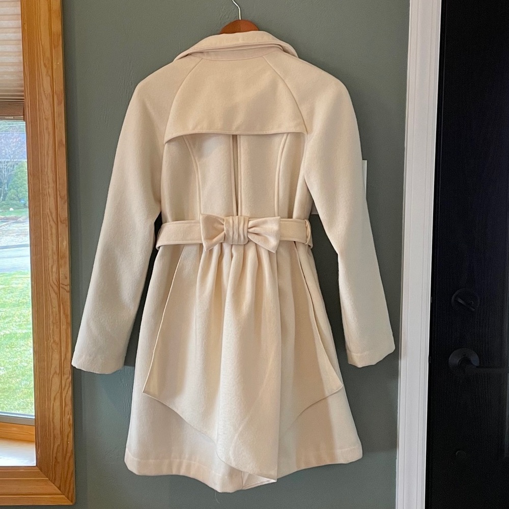 Women’s cream colored double breast skirt jacket
